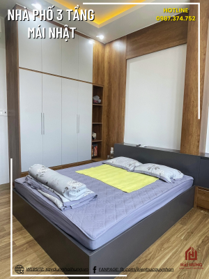 Phòng ngủ và không gian sinh hoạt của ngôi nhà phố mái Nhật 3 tầng 
