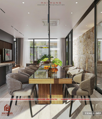 Phòng khách và khu bếp liên thông của thiết kế villa mái nhật đẹp hiện đại