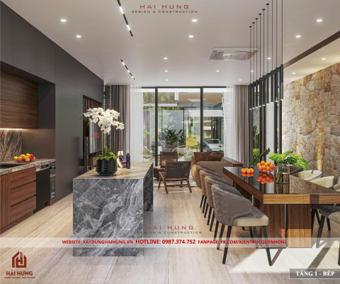 Phòng khách và khu bếp liên thông của thiết kế villa mái nhật đẹp hiện đại